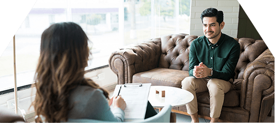 man with therapist undergoing drug and alcohol assessment