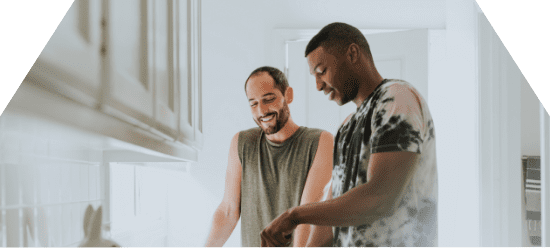 two men cooking in a residential treatment program