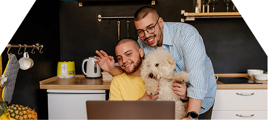 two men with dog receiving telehealth services