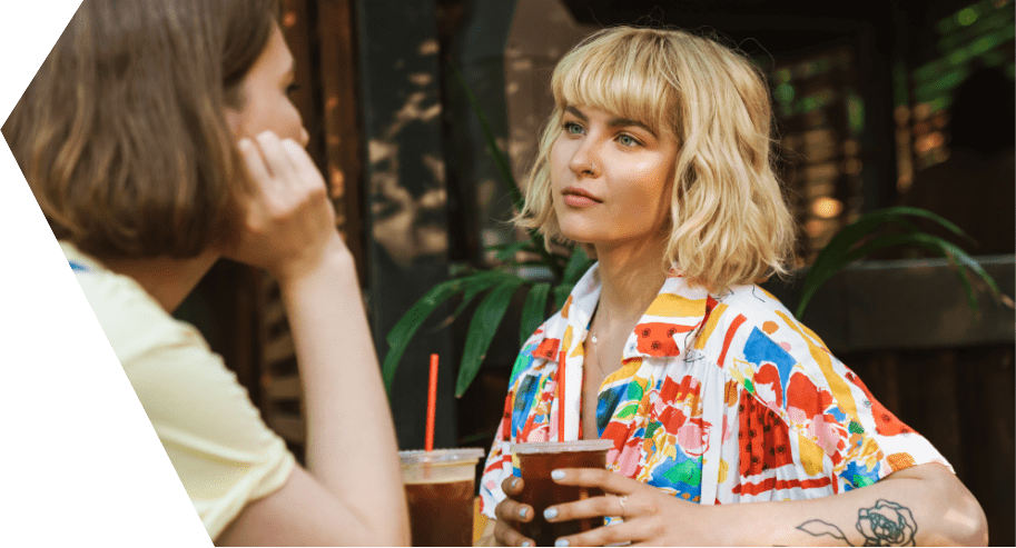woman listening to another about lgbtq therapy programs