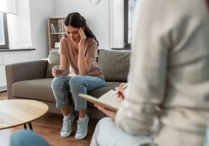 a young woman opens up in therapy for lgbtq alcohol addiction treatment 