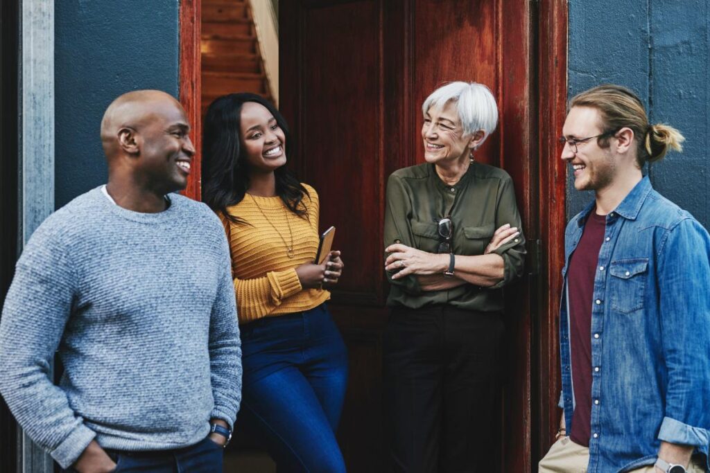 a diverse group of inpatient addiction treatment participants gather after group therapy