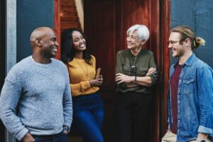 a diverse group of inpatient addiction treatment participants gather after group therapy