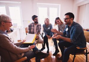 participants in an lgbtq group therapy program meet for a session