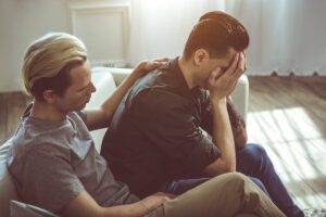 a young man convinces his partner to get help for mental health and addiction