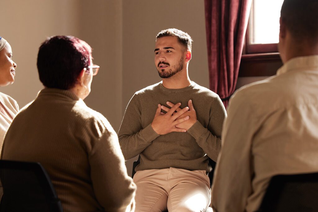 a man opens up in group therapy for synthetic drug abuse treatment